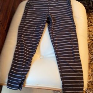 Athleta cropped black leggings with gray stripes